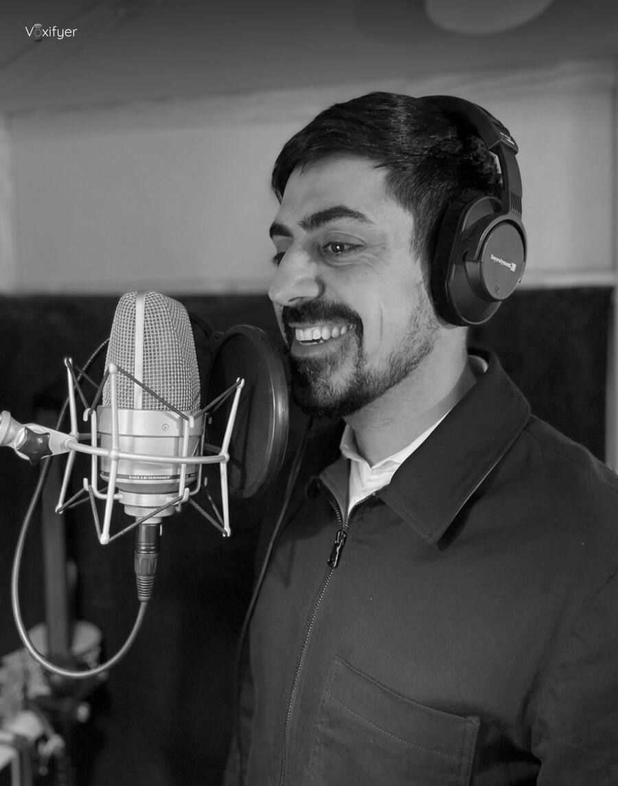 A talent smiling at the microphone